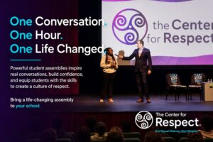Hall of Fame speaker Mike Domitrz speaking with a student volunteer during a Center for Respect school assembly about respect, consent, and healthy relationships.